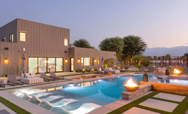 Contemporary estate, Mesquite 38, and its pristine pool exude serenity in the evening hours.