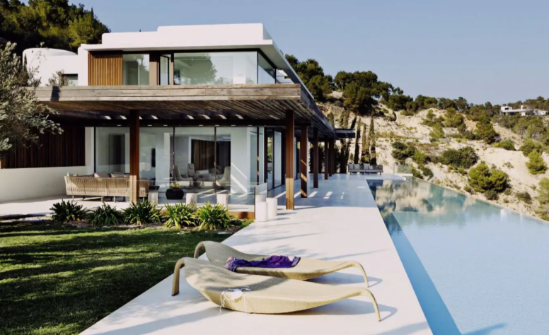 Modern luxury villa in Ibiza, Villa Sa Calma features an expansive infinity pool, serene Mediterranean views, and elegant outdoor spaces, providing the perfect sanctuary for IMS Ibiza attendees.