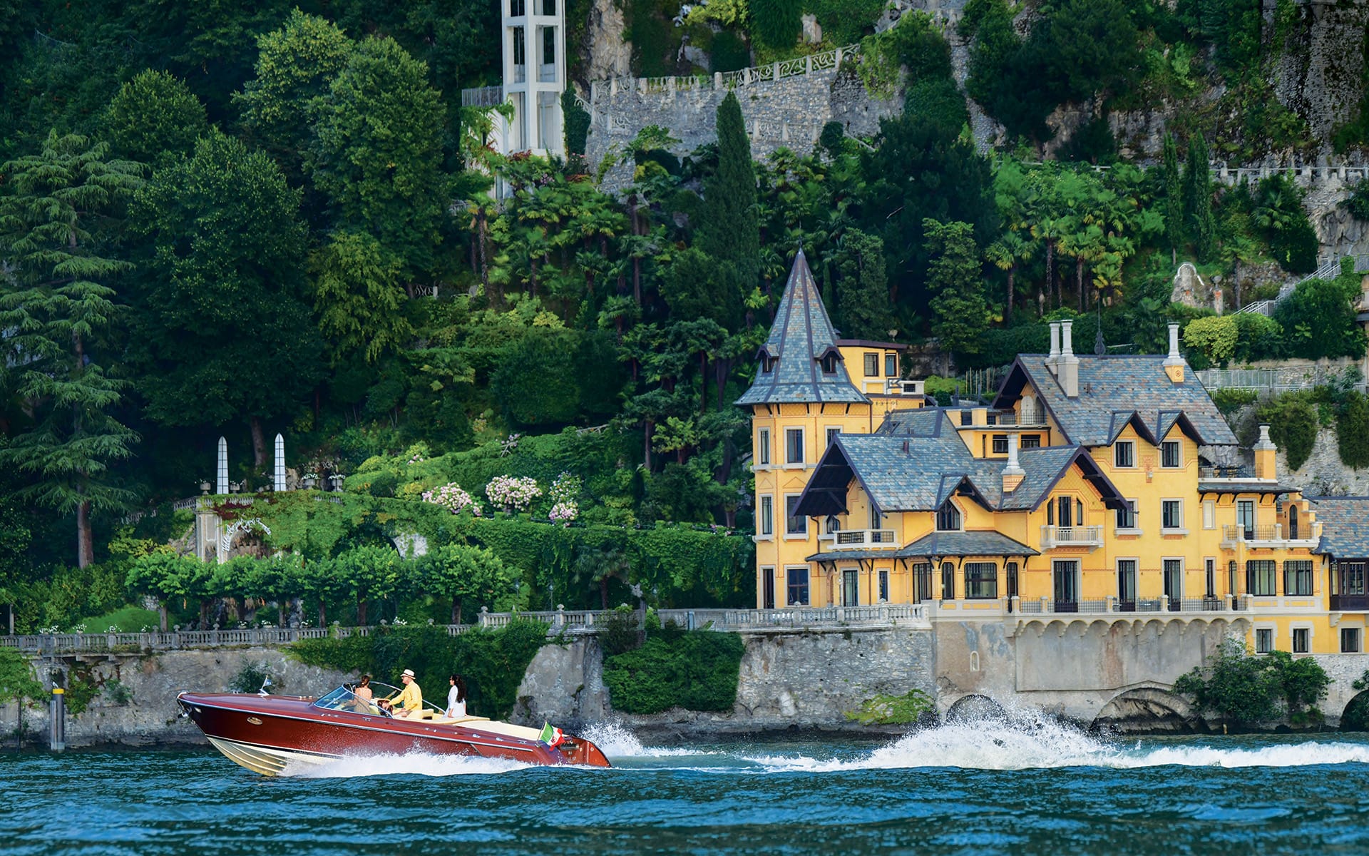 Private Riva boat cruising on Lake Como.