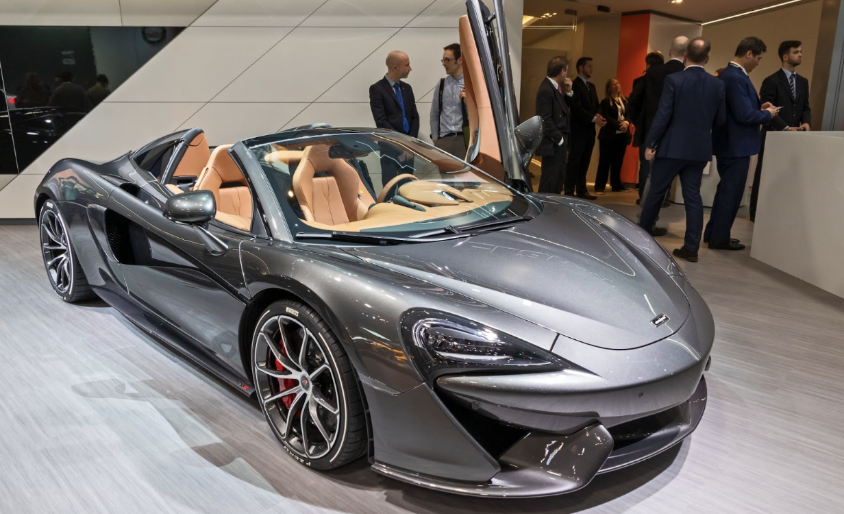 A spectacular view of the grey 2018 McLaren 570S Spider with apricot interior that defines sports car luxury