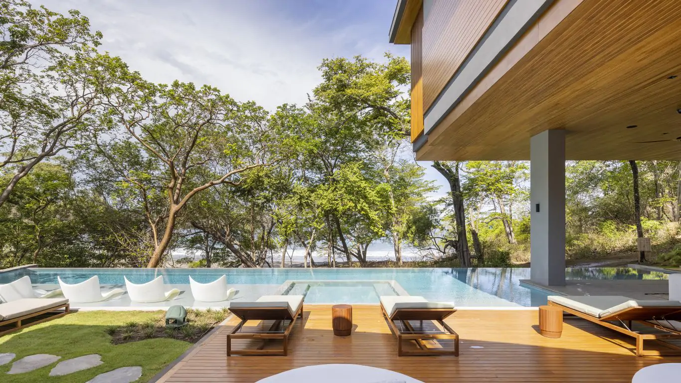 A modern oceanfront estate in Guanacaste featuring an infinity pool and sleek, open-air design.